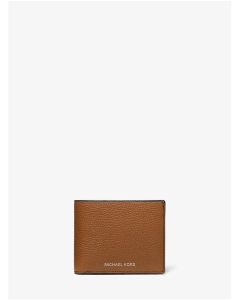 Michael Kors Cooper Slim Zip Pebble Leather Wallet in luggage.